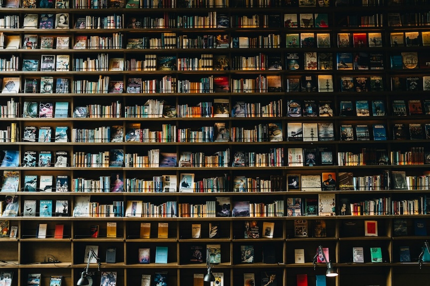 Floor-to-ceiling bookshelves filled with history titles, illustrating the best books on women's rights and gender in Asia during World War II